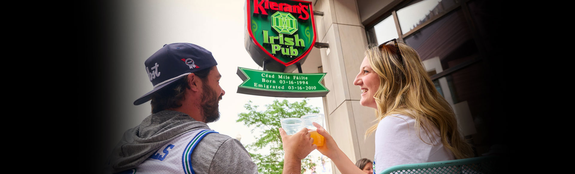 View of the Kieran's Irish Pub sign outside the Irish Pub in downtown Minneapolis with customers enjoying a drink